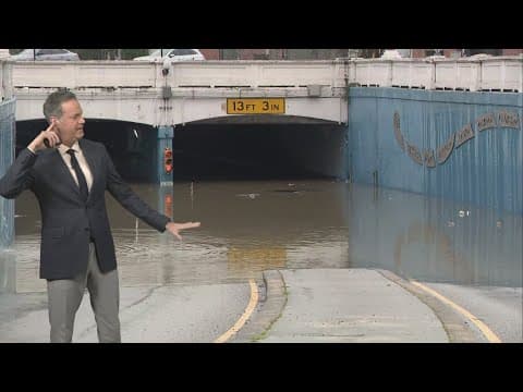 Watch: Car submerged in flooded Houston roadway