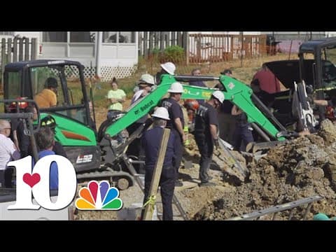 KFD working to rescue two men from trench