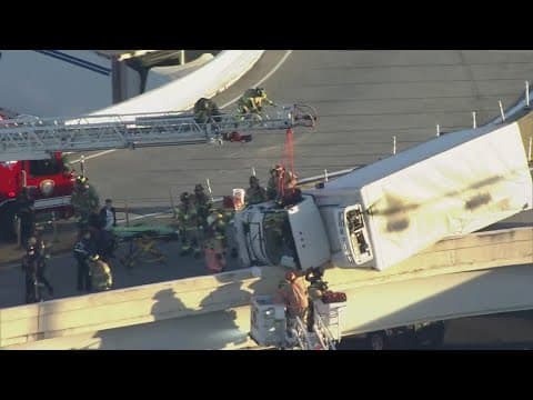 Driver in truck dangling over I-45 North rescued by firefighters