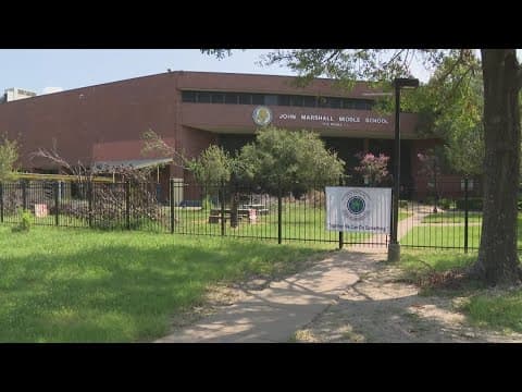 Houston's Near Northside community helps pick up storm debris outside Marshall Middle School
