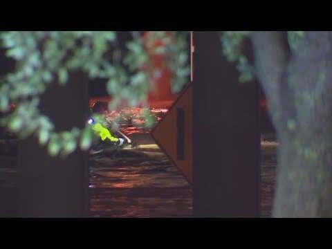 One person dies after being trapped by high water in his car