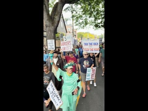 Scenes from 'Workers over Billionaires' march in Capitol Hill