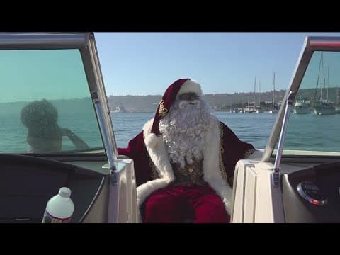 Black Santa swaps sleigh for a boat