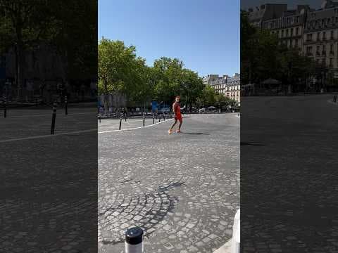 Street Artist Performs in Paris During Summer Olympics