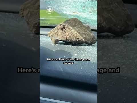 Rock thrown at moving car smashes driver's windshield