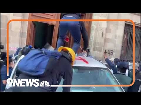 Protesters ram truck into presidential palace