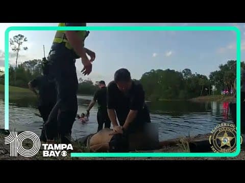 Driver rescued in Florida after crashing upside down into retention pond