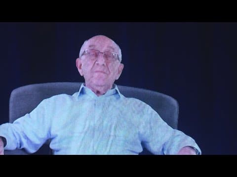 A son speaks with his late father, a victim of the holocaust, in hologram form