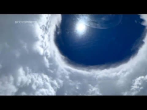 Dramatic view of Hurricane Erin's eye as planes fly through powerful storm