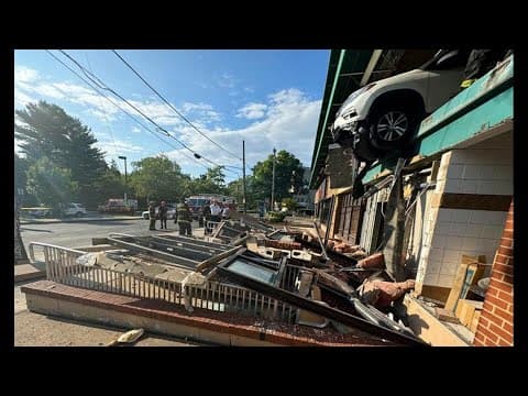 Car hangs by a thread at Tenleytown Whole Foods parking garage