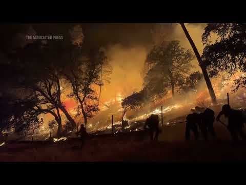 Firefighters battle growing wildfires in California as flames threaten forests and homes