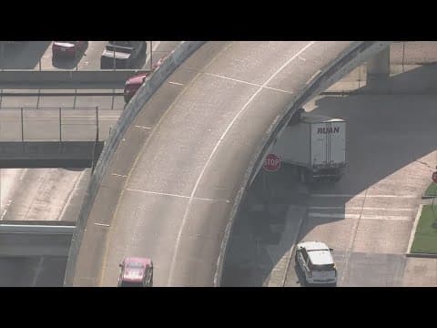 Big rig stuck under overpass northeast of downtown Houston