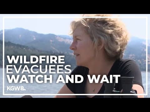 Evacuees anxiously watch the Tunnel 5 fire burning across from Hood River