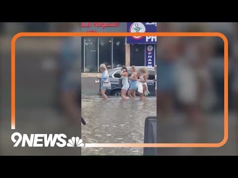 UAE: People wade through floodwaters in Dubai