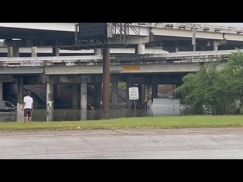 Man jumps off van stalled in floodwater near the South Loop and I-45