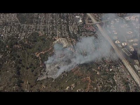 Firefighters stop forward progress of fire burning in Del Mar Heights