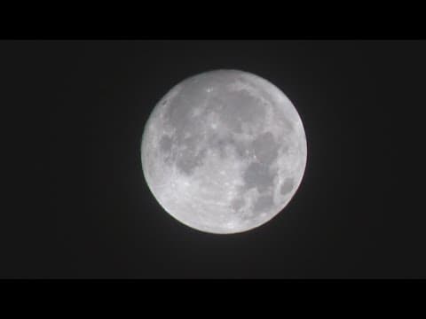 Will the clouds cover the view of the partial lunar eclipse tonight?