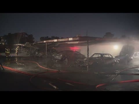 More than 30 cars were destroyed by a fire at an apartment complex