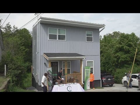 Nonprofit welcomes young family to new solar-powered homes as part of effort to address poverty