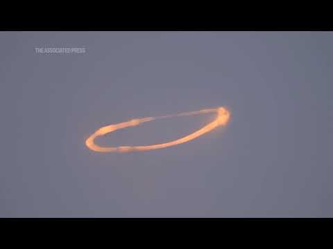 Mount Etna blows spectacular smoke rings into the sky