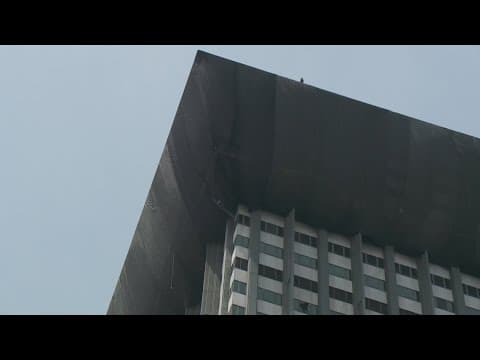 The Plaza Tower eyesore could get covered up for Super Bowl