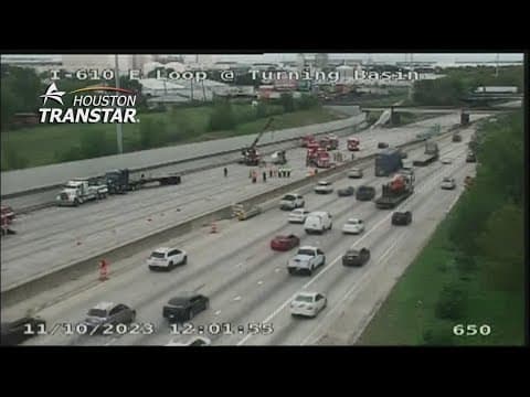 Overturned heavy truck blocking all lanes of East Loop heading south at Market Street