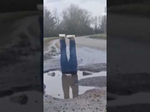 Legs Rise From Pothole