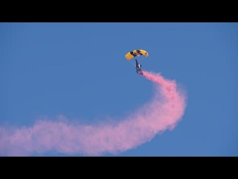The Golden Knights perform parachute jump to the flight deck of the USS Midway