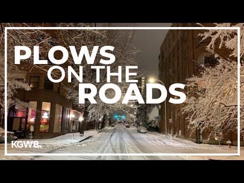 Plows and trucks treating Portland roads covered in snow