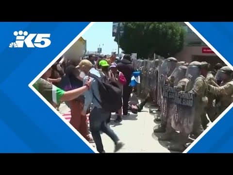 LAPD officers and National Guardsmen clash with protesters