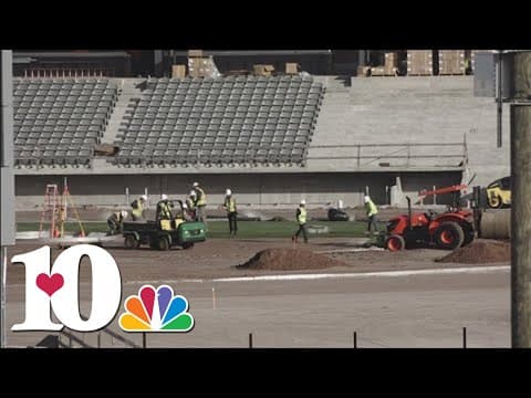 Crews installing grass at Covenant Health Park