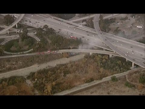 Brush fire under South Bay freeway overpass prompts road closure