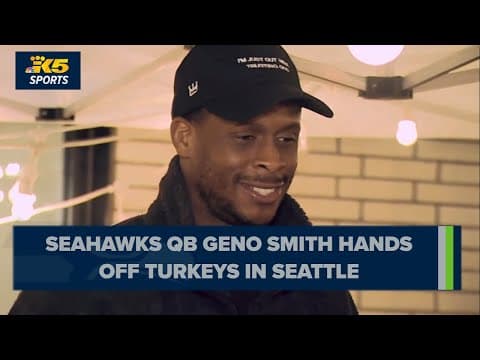 Seattle Seahawks quarterback Geno Smith hands out turkeys for Thanksgiving