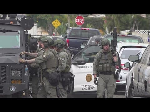 SWAT in standoff with armed man who allegedly threatened neighbor