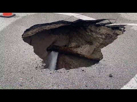 Water gushing from burst pipe in southeast Houston sinkhole