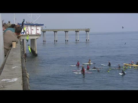 Junior Lifeguards jumping off Ocean Beach Pier to raise money for a great cause