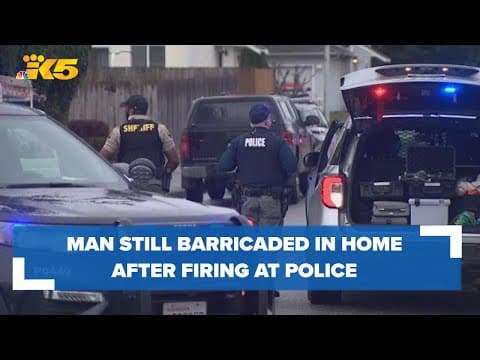 Man remains barricaded inside home after allegedly firing at police officers