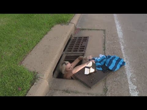 Houston woman jumps into storm drains to rescue trapped puppies