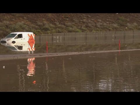 Cars submerged due to flooded roads in La Jolla and Mira Mesa