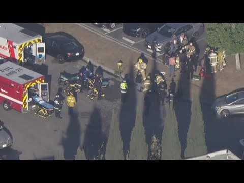Small plane crashes into building in Southern California, one dead, 15 injured