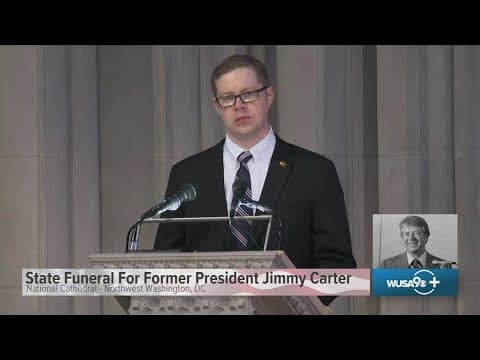 Joshua Carter, grandson of Jimmy Carter, reads at state funeral