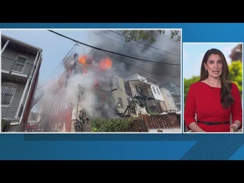 Firefighters are battling massive rowhouse fire in NW