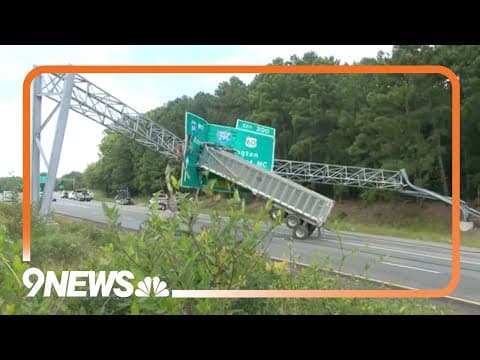 RAW: Bed of truck somehow gets stuck on overhead sign