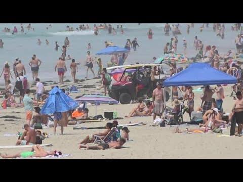 Massive crowds flock to San Diego beaches amid record breaking heat