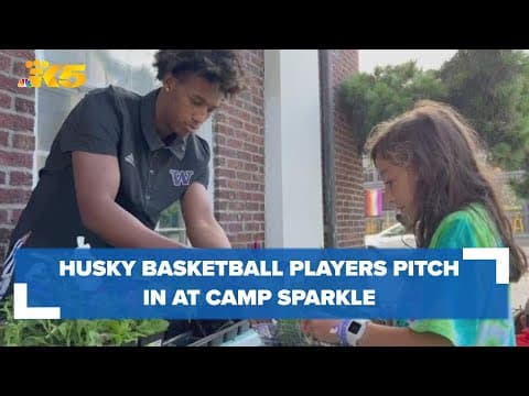 Husky basketball players pitch in at summer camp for kids impacted by cancer