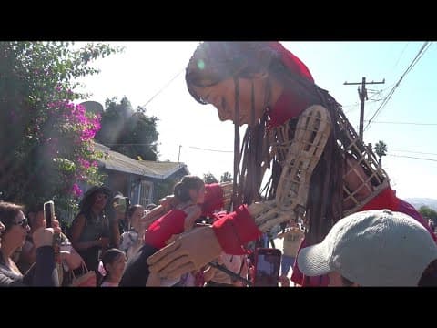 Giant puppet inspired by 10-year-old Syrian refugee stops in border town before Mexico