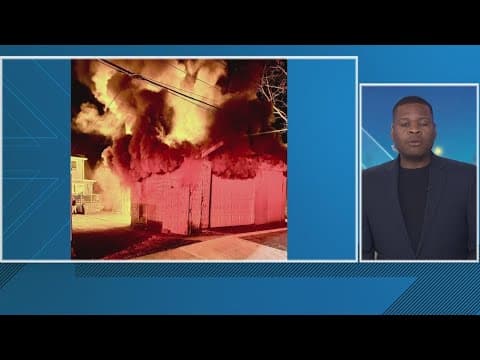 DC Fire put out two garages engulfed in flames behind apartment