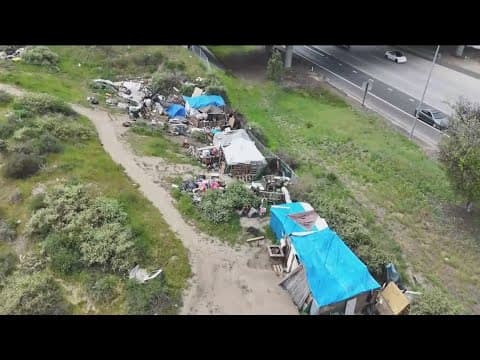 Neglected Chula Vista creek bed overrun with trash, encampments and fires
