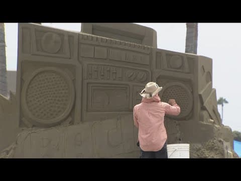Sand sculptors put finishing touches on giant sandcastle for Sun & Sea Festival on Aug 17