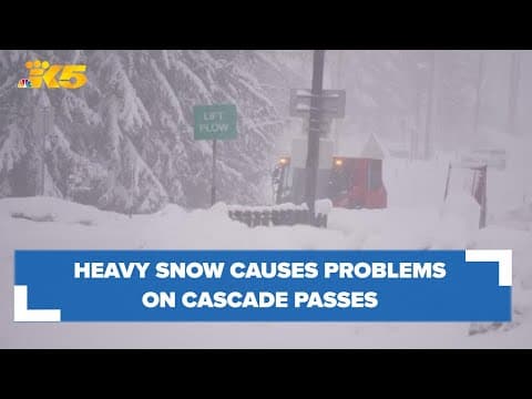 Drivers navigate travel over Cascade passes as snow continues to fall
